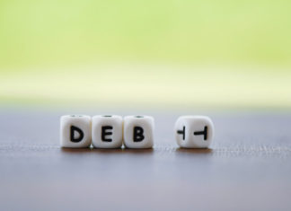 Is buying a house with debt a smart decision?